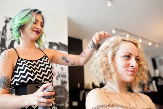photo of hair stylist and customer