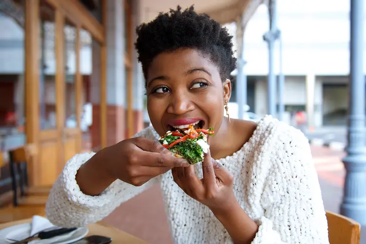 photo of woman eating