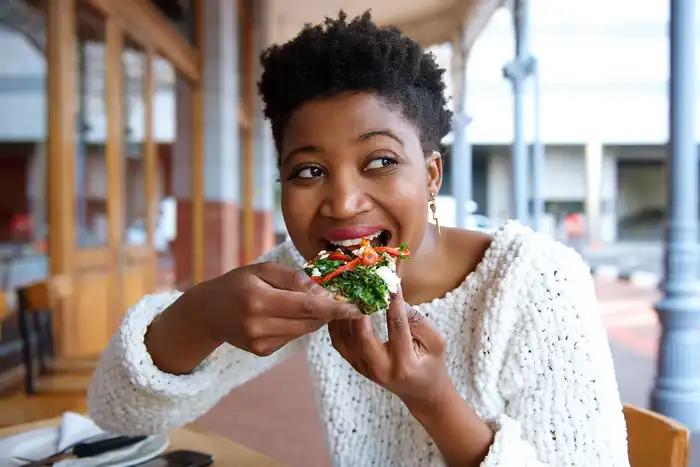 photo of woman eating