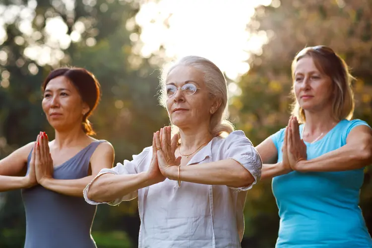 photo of mature women in yoga class