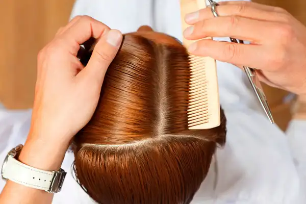 woman combing hair