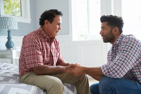 Man talking with elderly dad