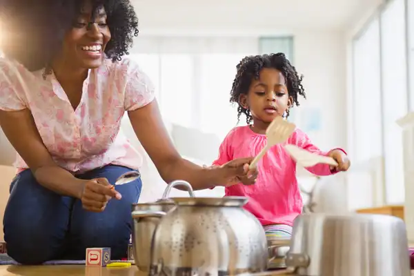 photo of mother and daughter playing